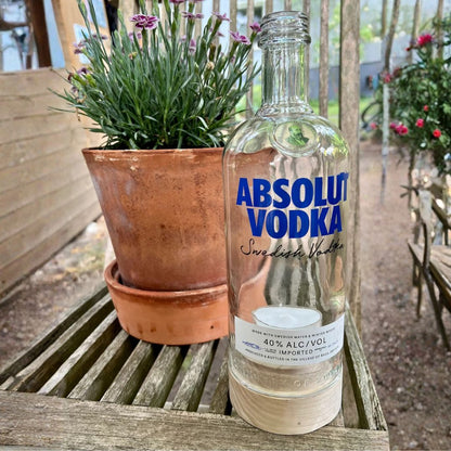 Recycled bottle tealight holder with wooden base